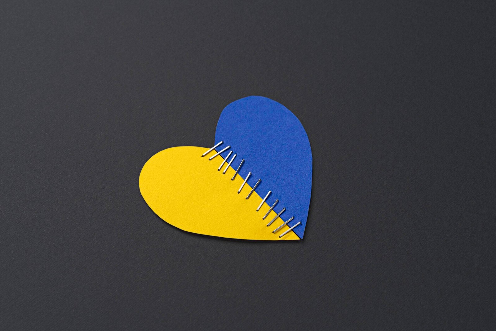 top-view-ukrainian-flag-heart-with-stitches
